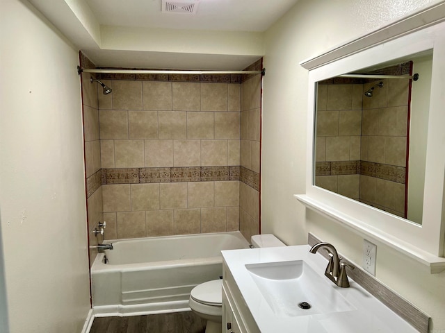 full bathroom featuring vanity, toilet, hardwood / wood-style flooring, and tiled shower / bath combo