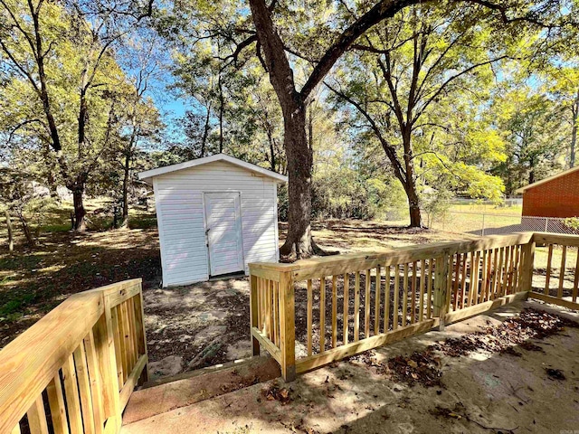 wooden deck featuring a storage shed