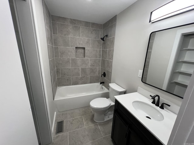 full bathroom with vanity, toilet, tile patterned floors, and tiled shower / bath combo