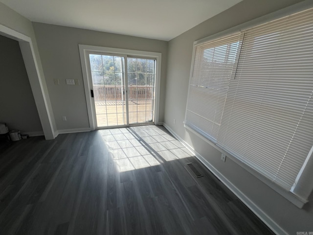 2916 Dalewood, Little Rock, AR 72207 - unfurnished dining area with baseboards, wood finished floors, and visible vents