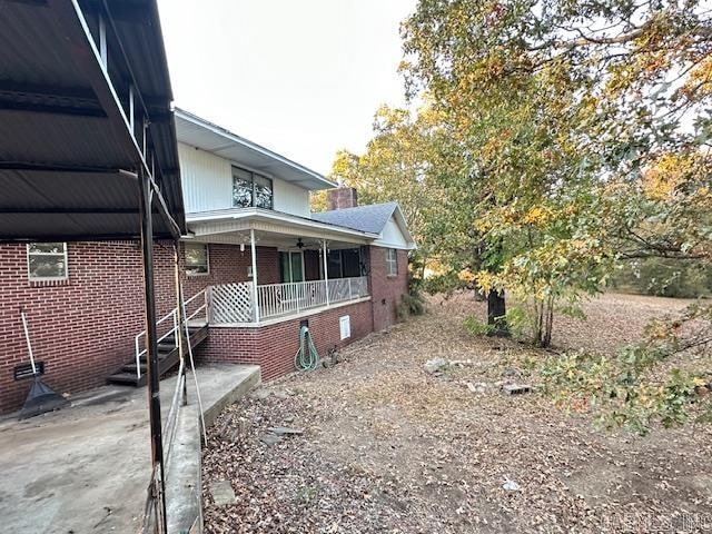 view of home's exterior featuring a porch