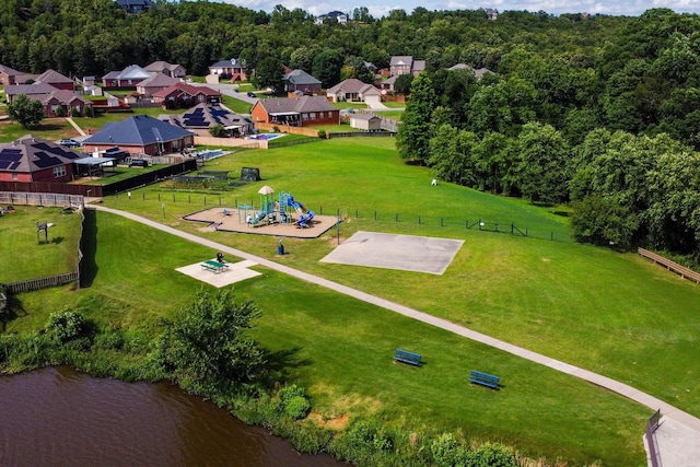 birds eye view of property with a water view