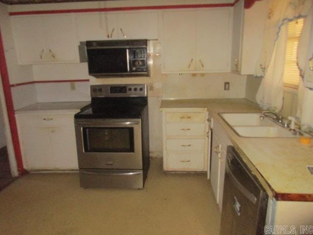 kitchen featuring appliances with stainless steel finishes, sink, and white cabinets