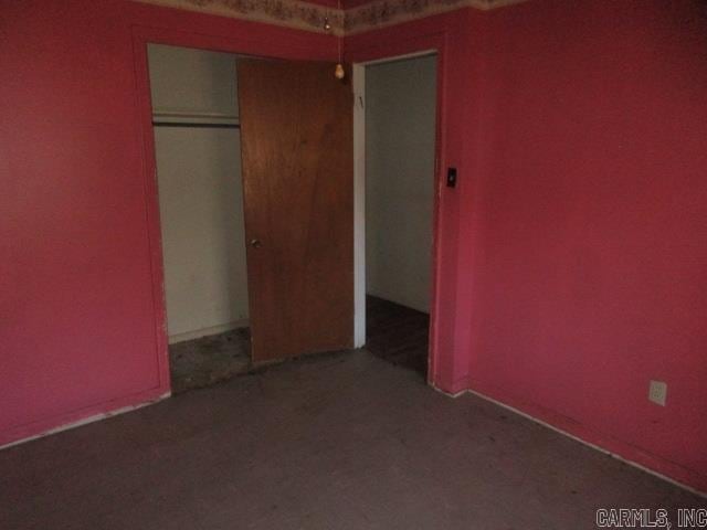 unfurnished bedroom featuring a closet