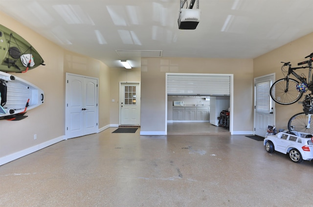 garage featuring a garage door opener