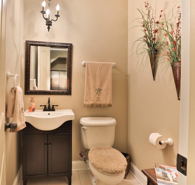 bathroom featuring vanity, toilet, and tile patterned flooring