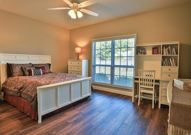 bedroom with dark wood-type flooring and ceiling fan