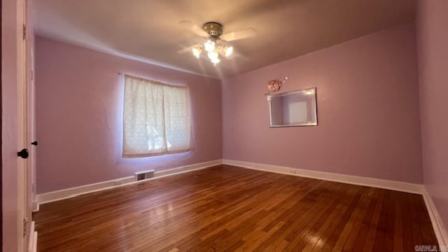 empty room featuring ceiling fan and wood-type flooring