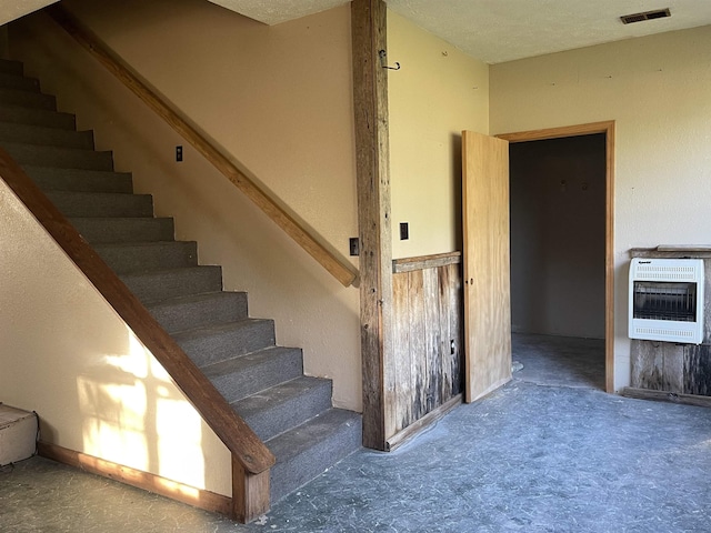 203 Mcclamrock, Portia, AR 72457 - stairway featuring visible vents, carpet flooring, and heating unit