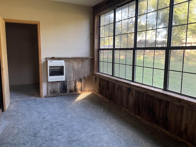 203 Mcclamrock, Portia, AR 72457 - unfurnished room with heating unit and wooden walls