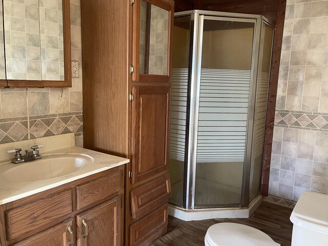 203 Mcclamrock, Portia, AR 72457 - full bath with tile walls, a stall shower, vanity, and toilet