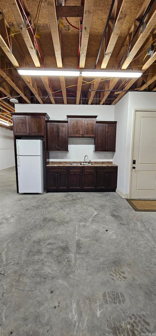 garage featuring white fridge