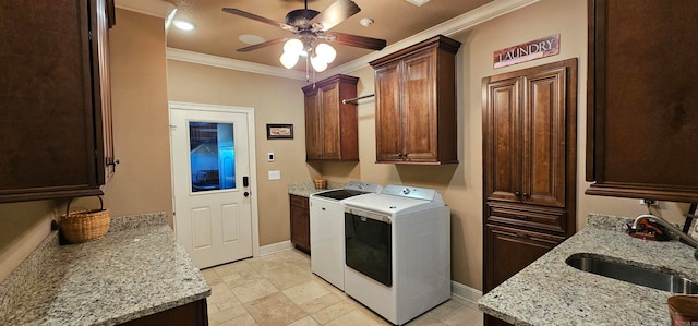 washroom featuring cabinets, ceiling fan, independent washer and dryer, crown molding, and sink