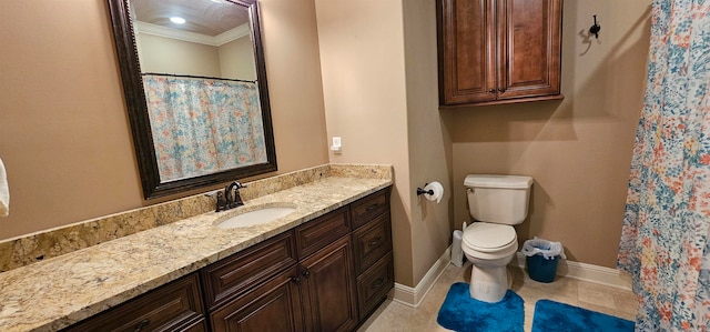 bathroom with vanity, crown molding, toilet, and tile patterned flooring