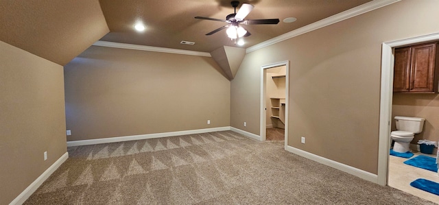 additional living space with lofted ceiling, a textured ceiling, light colored carpet, and ceiling fan