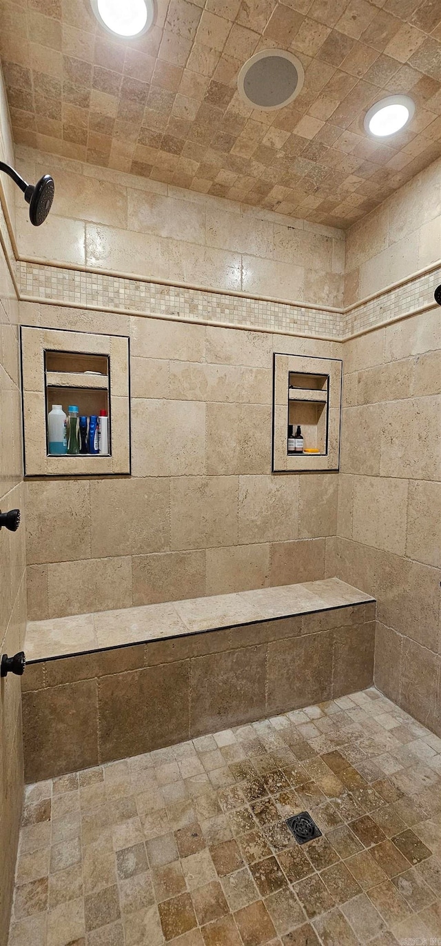 bathroom with tiled shower