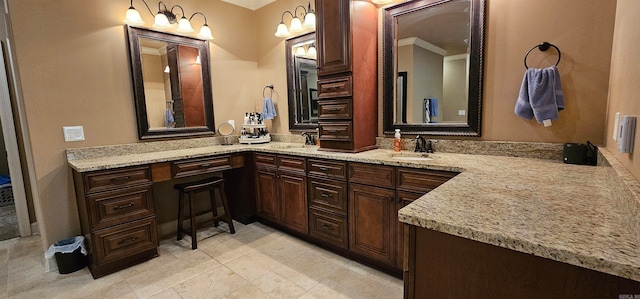 bathroom with vanity and crown molding