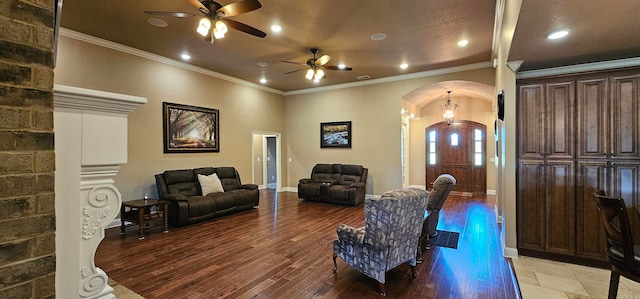 living room featuring ornamental molding, hardwood / wood-style flooring, and ceiling fan