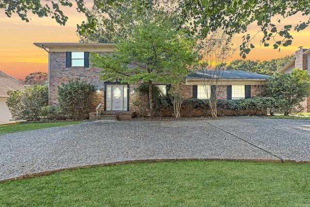 view of front of property with a lawn