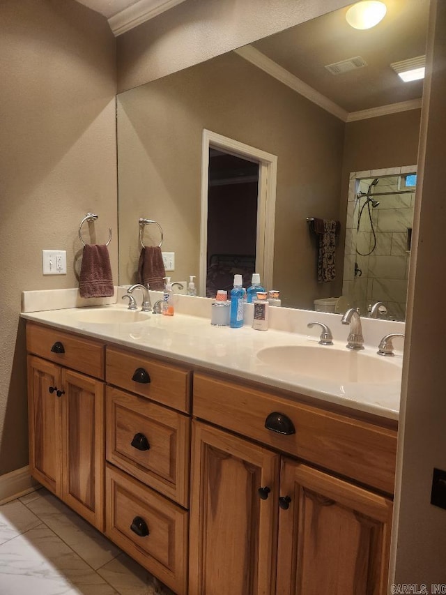 bathroom with vanity and ornamental molding