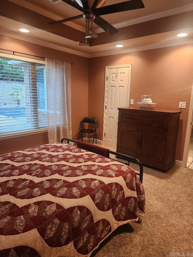 bedroom featuring ceiling fan, ornamental molding, and carpet floors