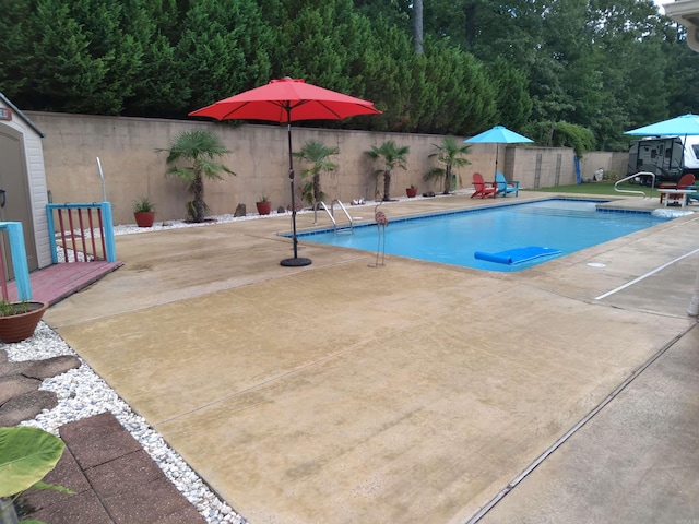 view of pool featuring a patio area