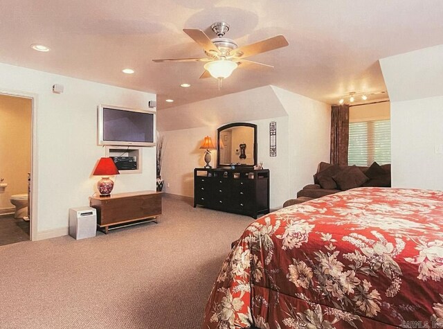 bedroom with ensuite bath, carpet, and ceiling fan