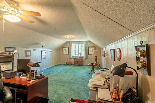 carpeted home office with lofted ceiling, a textured ceiling, and ceiling fan