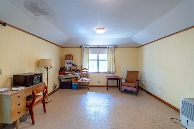 sitting room featuring lofted ceiling and crown molding