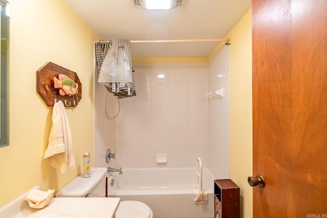 full bathroom with vanity, toilet, and tiled shower / bath