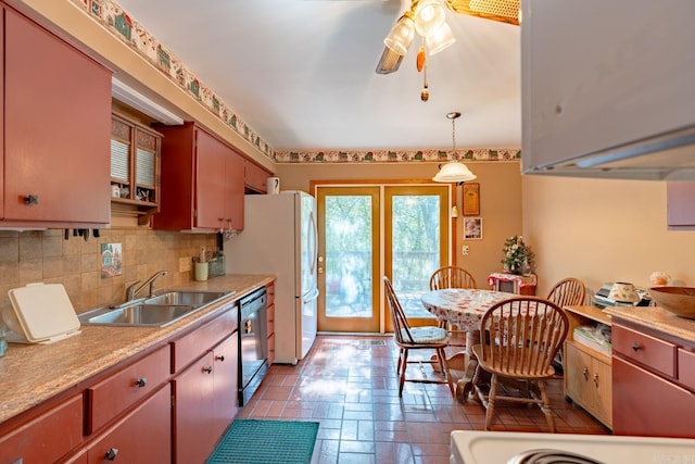 kitchen with sink, dishwasher, french doors, ceiling fan, and decorative light fixtures