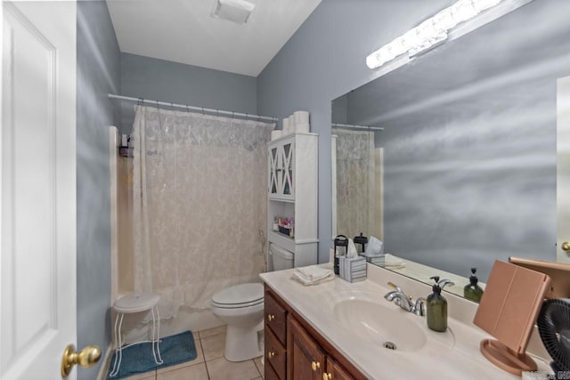 bathroom with toilet, vanity, a shower with shower curtain, and tile patterned flooring