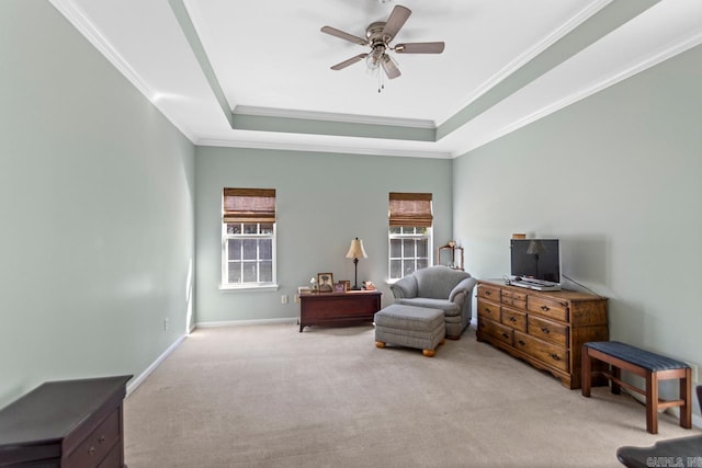 sitting room featuring light colored carpet, a healthy amount of sunlight, and ceiling fan