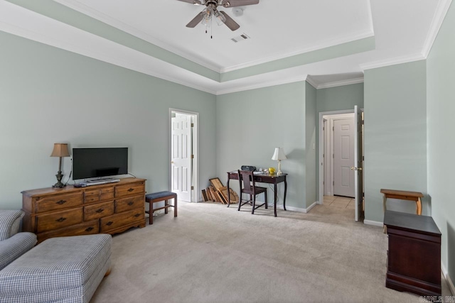 sitting room with crown molding, light colored carpet, a raised ceiling, and ceiling fan