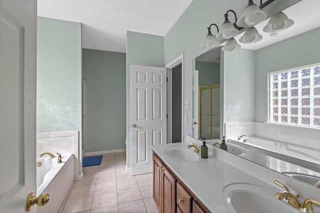 bathroom with vanity, tile patterned floors, and shower with separate bathtub