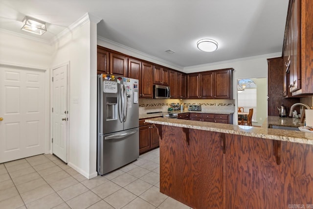 kitchen with kitchen peninsula, light stone counters, appliances with stainless steel finishes, ornamental molding, and sink