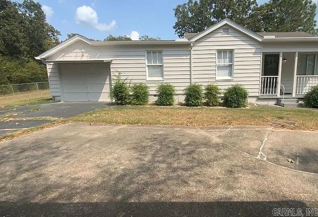 view of front facade with a porch and a garage