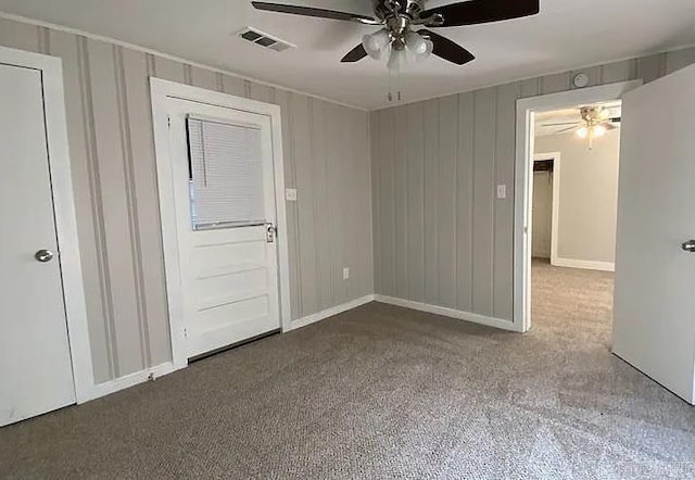 spare room with ceiling fan and carpet flooring