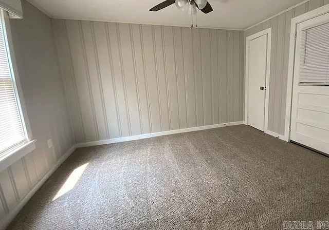 carpeted empty room with ceiling fan