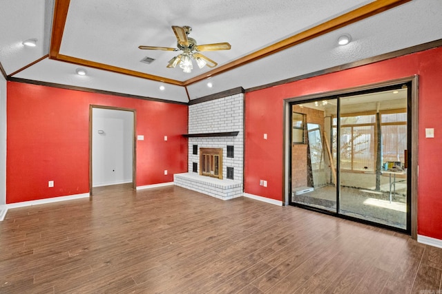 unfurnished living room featuring a textured ceiling, wood-type flooring, and a fireplace