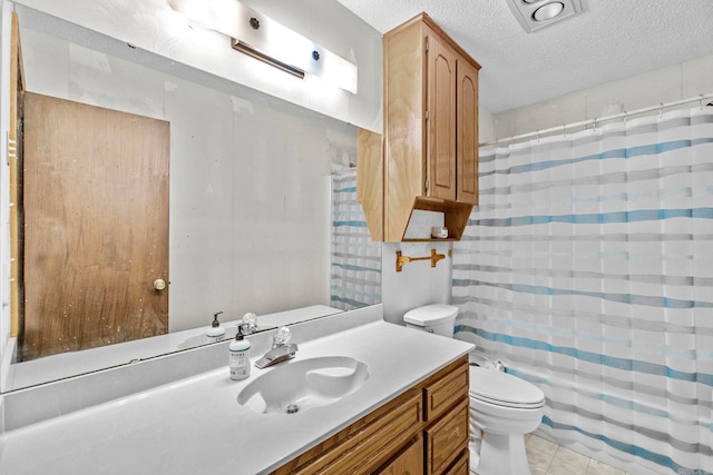 bathroom with toilet, tile patterned flooring, a shower with shower curtain, vanity, and a textured ceiling