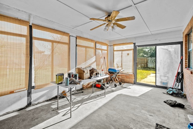 sunroom featuring ceiling fan