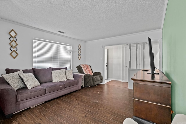 living room featuring crown molding, dark hardwood / wood-style floors, and a textured ceiling