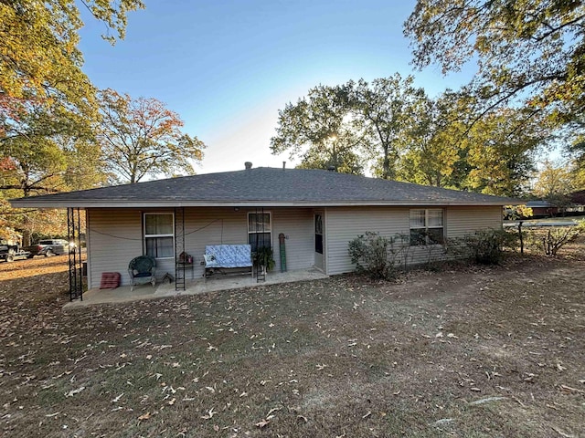 rear view of property featuring a patio