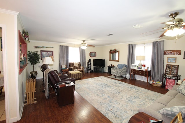 living room with ornamental molding, dark hardwood / wood-style floors, and ceiling fan