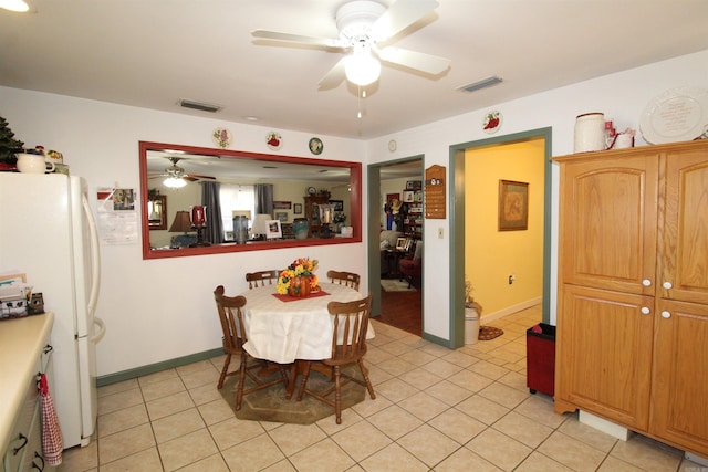 dining area featuring visible vents, ceiling fan, baseboards, and light tile patterned floors