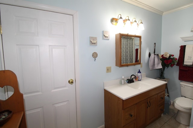 bathroom featuring vanity, toilet, tile patterned floors, and ornamental molding