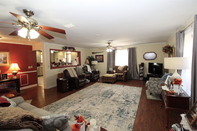 living room featuring ceiling fan, crown molding, and dark hardwood / wood-style flooring