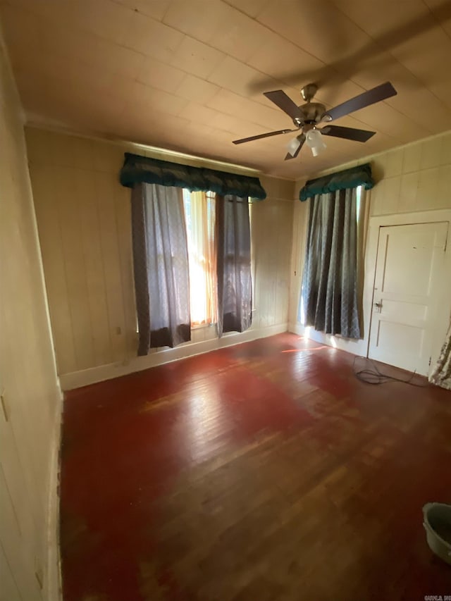 unfurnished room featuring hardwood / wood-style floors and ceiling fan