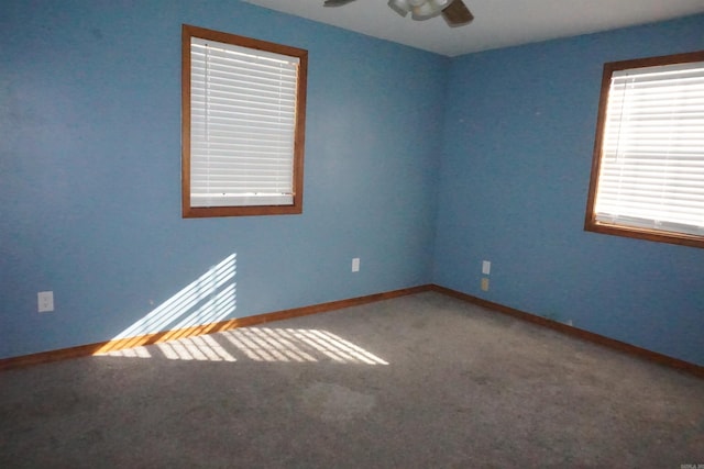 unfurnished room with carpet and ceiling fan